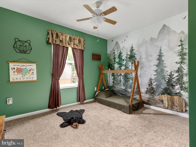 unfurnished bedroom with carpet, baseboards, and a ceiling fan