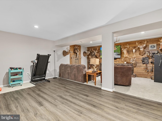 living area featuring wood finished floors, recessed lighting, and baseboards