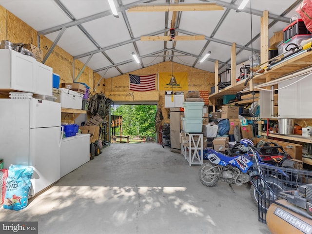 garage with freestanding refrigerator