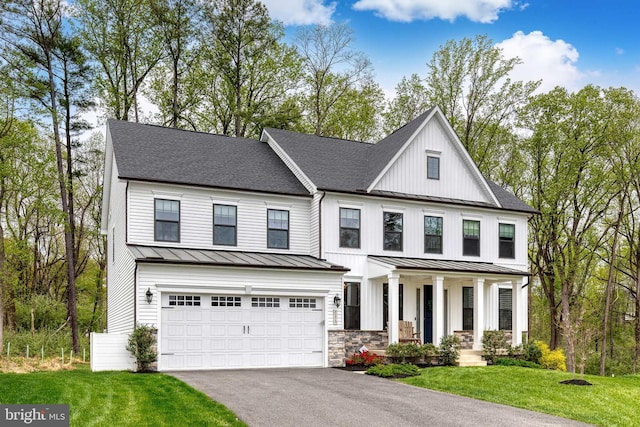 7679 Cross Creek Dr, Columbia, MD 21044 - view of front of property with a standing seam roof, covered porch, asphalt driveway, and a garage