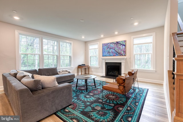 7679 Cross Creek Dr, Columbia, MD 21044 - living area with a fireplace with flush hearth, light wood-style floors, baseboards, and recessed lighting