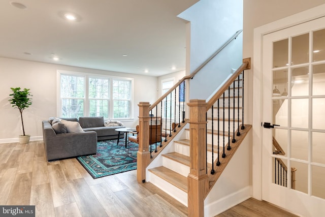 7679 Cross Creek Dr, Columbia, MD 21044 - stairway with wood finished floors, baseboards, and recessed lighting