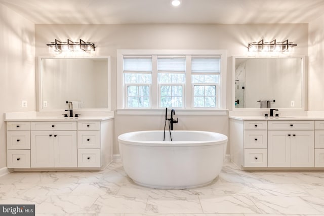 7679 Cross Creek Dr, Columbia, MD 21044 - full bathroom with marble finish flooring, a freestanding bath, recessed lighting, two vanities, and a shower