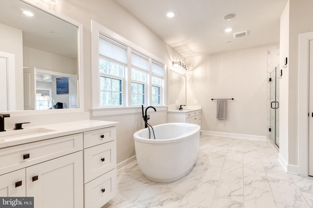 7679 Cross Creek Dr, Columbia, MD 21044 - bathroom featuring marble finish flooring, a shower stall, a freestanding bath, baseboards, and two vanities