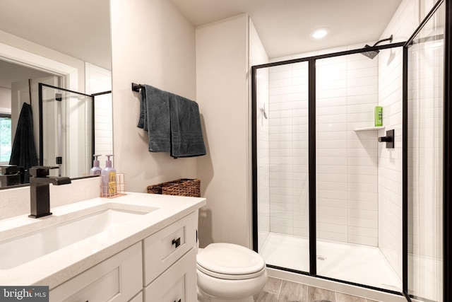 7679 Cross Creek Dr, Columbia, MD 21044 - full bath featuring a stall shower, toilet, vanity, and wood finished floors