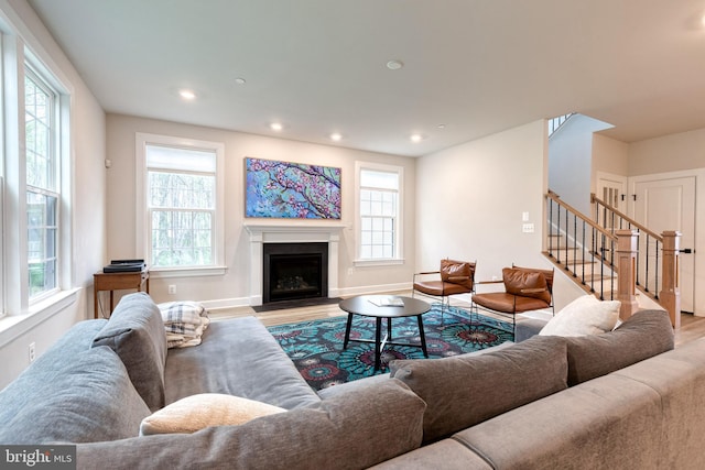 7679 Cross Creek Dr, Columbia, MD 21044 - living room featuring stairway, wood finished floors, plenty of natural light, and recessed lighting