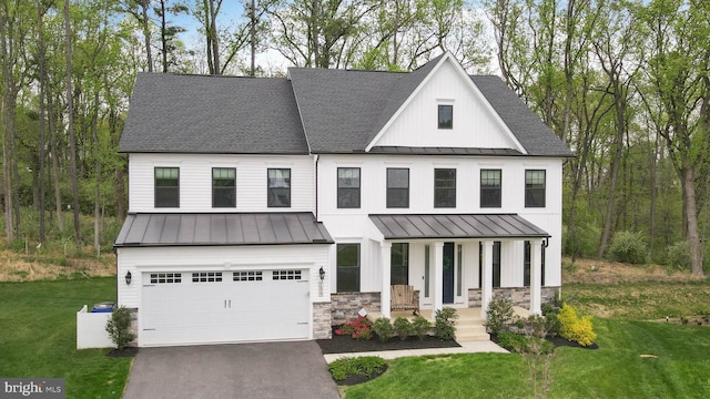 7679 Cross Creek Dr, Columbia, MD 21044 - modern farmhouse style home featuring a standing seam roof, metal roof, an attached garage, driveway, and a porch