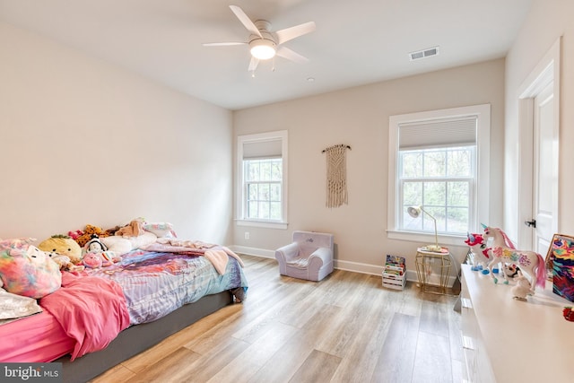7679 Cross Creek Dr, Columbia, MD 21044 - bedroom with wood finished floors, baseboards, and a ceiling fan