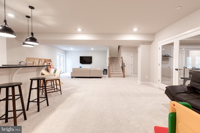 7679 Cross Creek Dr, Columbia, MD 21044 - living area featuring light colored carpet, recessed lighting, stairs, baseboards, and healthy amount of natural light