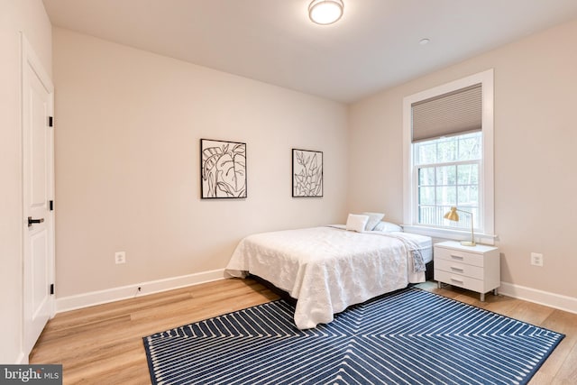 7679 Cross Creek Dr, Columbia, MD 21044 - bedroom featuring light wood-style flooring and baseboards