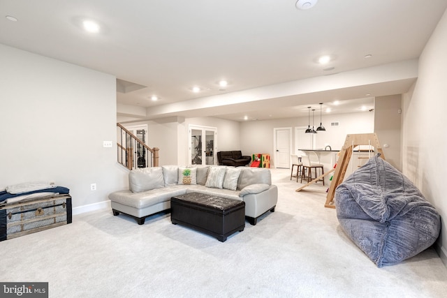 7679 Cross Creek Dr, Columbia, MD 21044 - living area featuring light colored carpet, recessed lighting, stairs, and baseboards