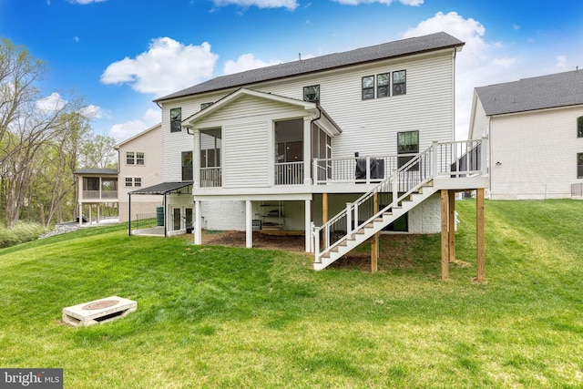7679 Cross Creek Dr, Columbia, MD 21044 - rear view of house featuring a sunroom, stairs, a wooden deck, and a lawn