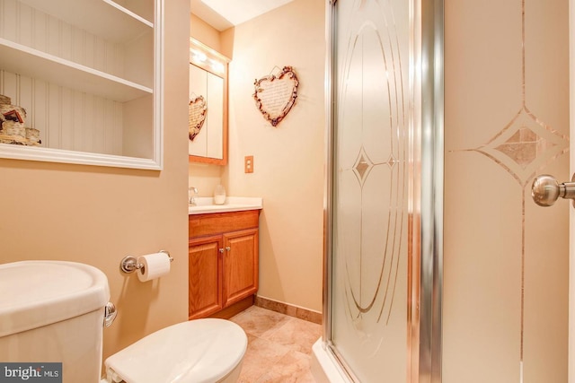 full bath featuring a stall shower, toilet, vanity, and tile patterned flooring