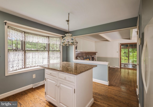 1149 Ollerton Rd, West Deptford, NJ 08066 - kitchen with a chandelier, white cabinets, dark wood-style flooring, a center island, and beamed ceiling