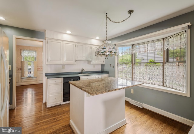 1149 Ollerton Rd, West Deptford, NJ 08066 - kitchen featuring a sink, black dishwasher, recessed lighting, white cabinets, and plenty of natural light