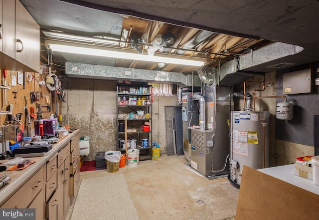 1149 Ollerton Rd, West Deptford, NJ 08066 - unfinished below grade area featuring gas water heater, heating unit, and a workshop area