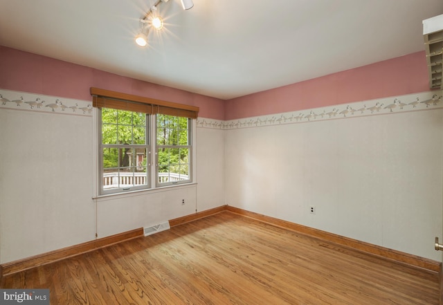 1149 Ollerton Rd, West Deptford, NJ 08066 - spare room featuring light wood-style floors, baseboards, and rail lighting