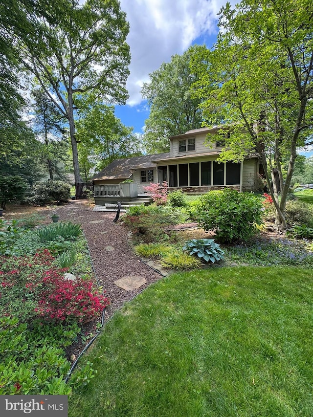 1149 Ollerton Rd, West Deptford, NJ 08066 - rear view of property with a sunroom, a yard, and a deck