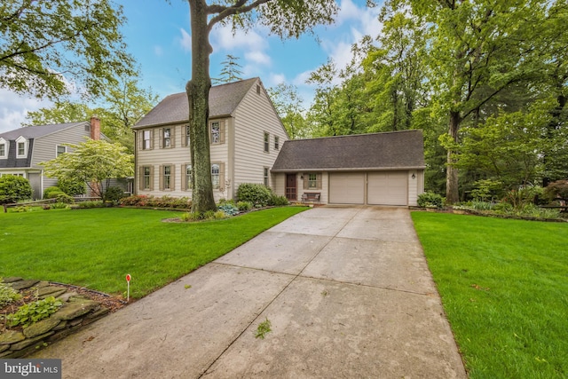 1149 Ollerton Rd, West Deptford, NJ 08066 - colonial house featuring a garage, driveway, a front lawn, and roof with shingles