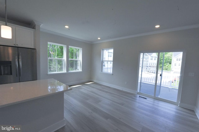 12371 Sea Oaks Ln Unit 1, Berlin, MD 21811 - unfurnished living room featuring ornamental molding, light wood finished floors, baseboards, and recessed lighting