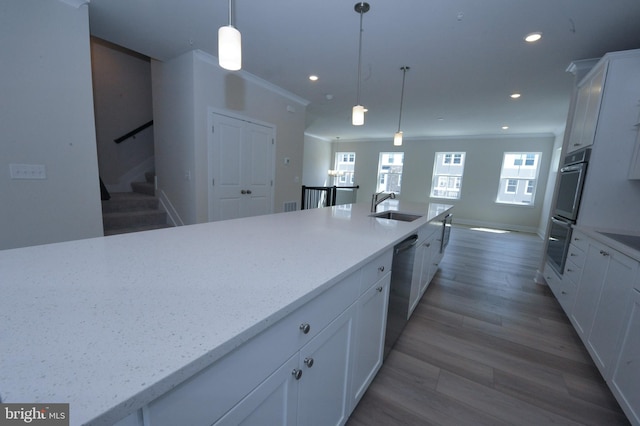 12371 Sea Oaks Ln Unit 1, Berlin, MD 21811 - kitchen featuring a sink, white cabinets, recessed lighting, decorative light fixtures, and light stone countertops