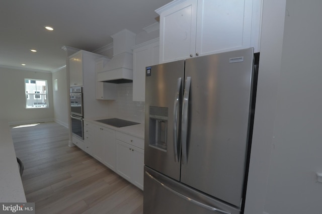 12371 Sea Oaks Ln Unit 1, Berlin, MD 21811 - kitchen featuring stainless steel appliances, ornamental molding, light wood-style flooring, recessed lighting, and backsplash