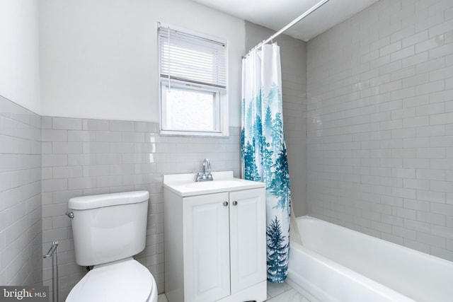 1545 S 19th St, Philadelphia, PA 19146 - bathroom featuring a sink, toilet, tile walls, wainscoting, and shower / bathtub combination with curtain