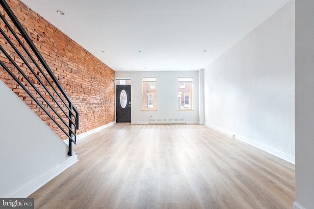 1545 S 19th St, Philadelphia, PA 19146 - foyer entrance with baseboards, stairway, wood finished floors, and a baseboard radiator