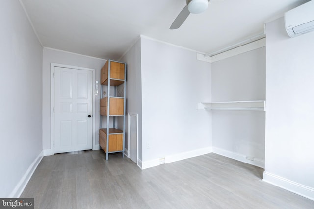 1545 S 19th St, Philadelphia, PA 19146 - empty room with a ceiling fan, baseboards, wood finished floors, and an AC wall unit