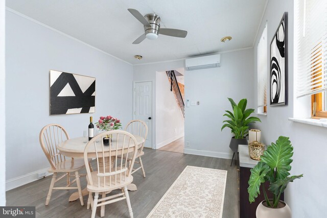 1545 S 19th St, Philadelphia, PA 19146 - dining area featuring a wall mounted air conditioner, wood finished floors, ornamental molding, a ceiling fan, and baseboards