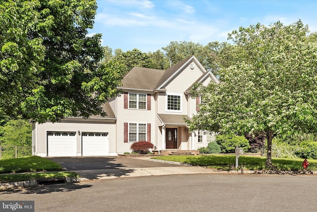 21 Jimarie Ct, Hamilton, NJ 08620 - view of front of house featuring driveway, an attached garage, and roof with shingles