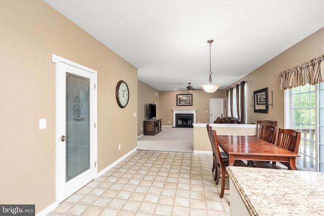 21 Jimarie Ct, Hamilton, NJ 08620 - dining space featuring a fireplace, a ceiling fan, and baseboards