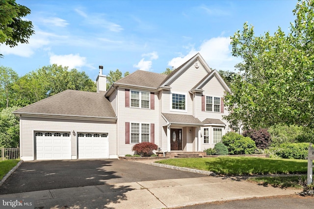 21 Jimarie Ct, Hamilton, NJ 08620 - traditional-style house featuring asphalt driveway, a garage, a chimney, roof with shingles, and a front lawn