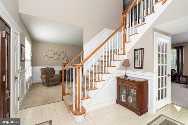 21 Jimarie Ct, Hamilton, NJ 08620 - staircase with carpet floors, tile patterned flooring, a wainscoted wall, and a decorative wall