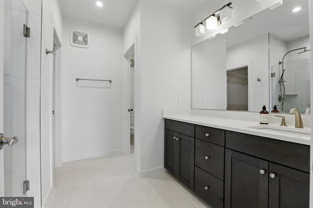 4140 Legato Rd Unit 47, Fairfax, VA 22033 - bathroom with a shower, vanity, recessed lighting, baseboards, and toilet
