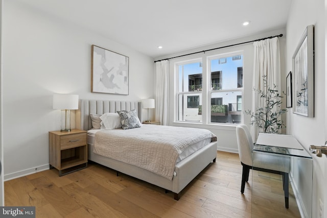 4140 Legato Rd Unit 47, Fairfax, VA 22033 - bedroom with light wood finished floors, recessed lighting, and baseboards