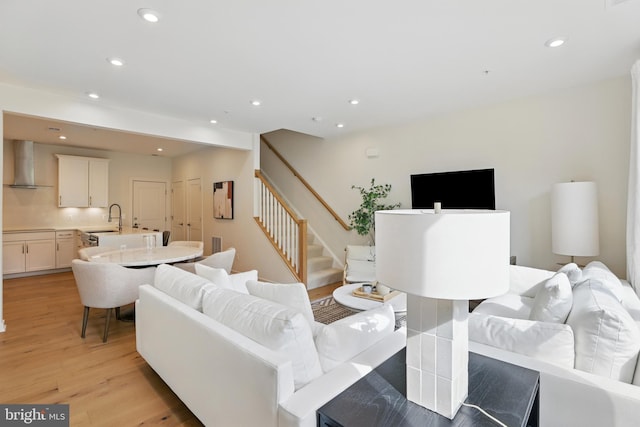 4140 Legato Rd Unit 47, Fairfax, VA 22033 - living area featuring light wood-style flooring, recessed lighting, and stairway