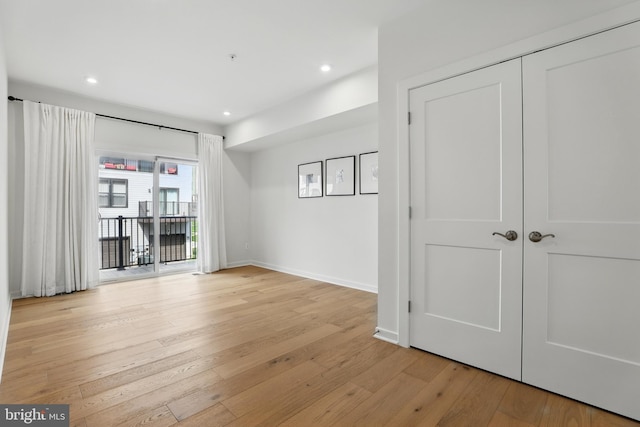 4140 Legato Rd Unit 47, Fairfax, VA 22033 - unfurnished living room featuring light wood finished floors, recessed lighting, and baseboards