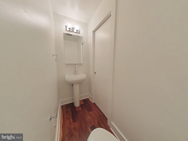 117 Quarry St Unit 9, Philadelphia, PA 19106 - half bathroom featuring wood finished floors, baseboards, and toilet