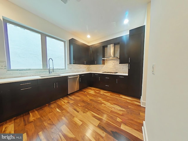 117 Quarry St Unit 9, Philadelphia, PA 19106 - kitchen featuring stainless steel dishwasher, wall chimney range hood, a sink, gas cooktop, and light countertops