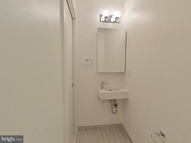 117 Quarry St Unit 9, Philadelphia, PA 19106 - bathroom featuring baseboards and a sink