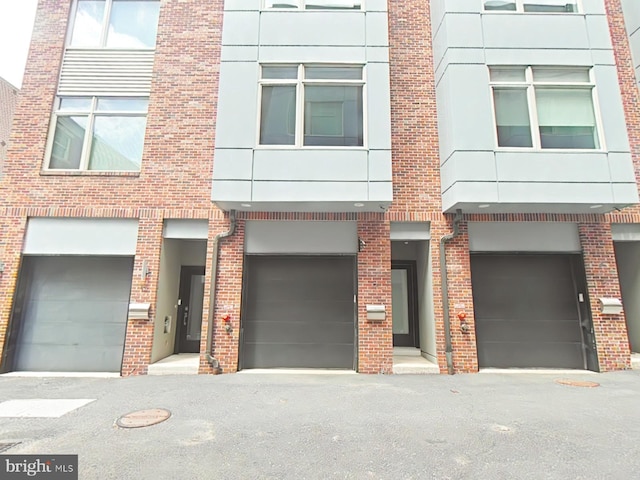 117 Quarry St Unit 9, Philadelphia, PA 19106 - townhome / multi-family property featuring an attached garage and brick siding