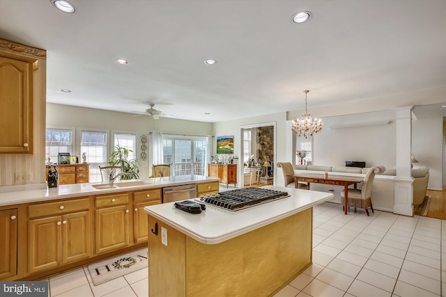 kitchen featuring appliances with stainless steel finishes, open floor plan, a sink, light tile patterned flooring, and recessed lighting