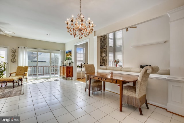 dining area with a chandelier, a ceiling fan, light tile patterned floors, and baseboards