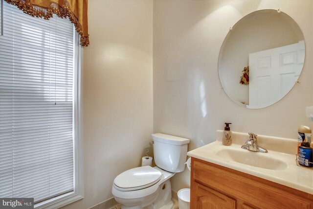 bathroom with toilet and vanity