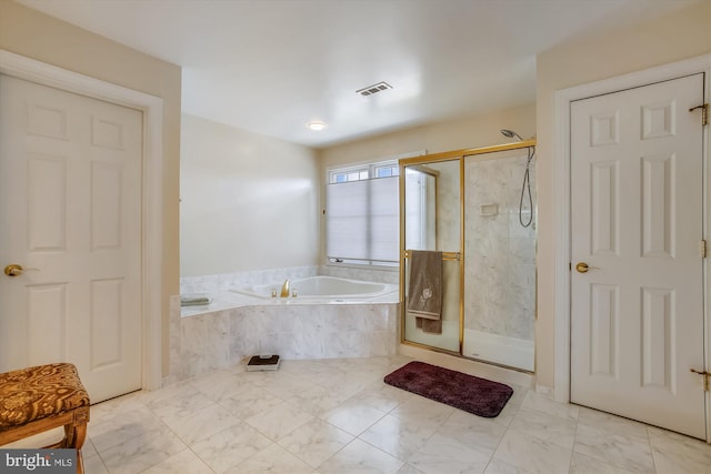 full bath featuring a shower stall and a garden tub