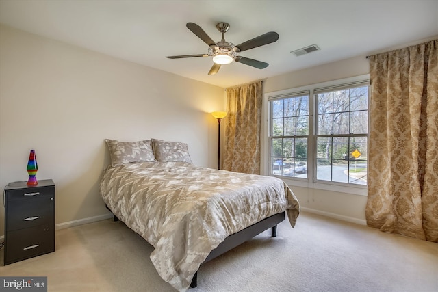 bedroom with baseboards, carpet flooring, and ceiling fan