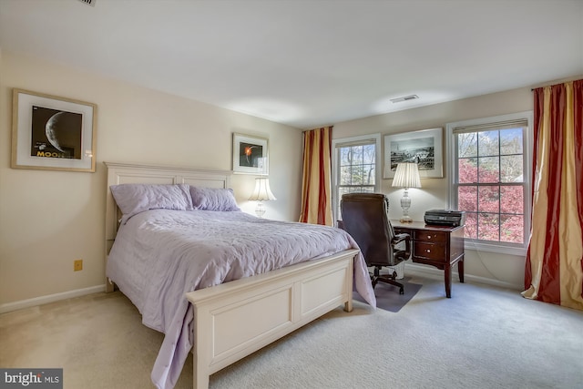 bedroom with carpet, baseboards, and a desk