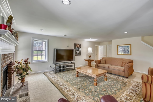 carpeted living area featuring a fireplace, baseboards, and recessed lighting