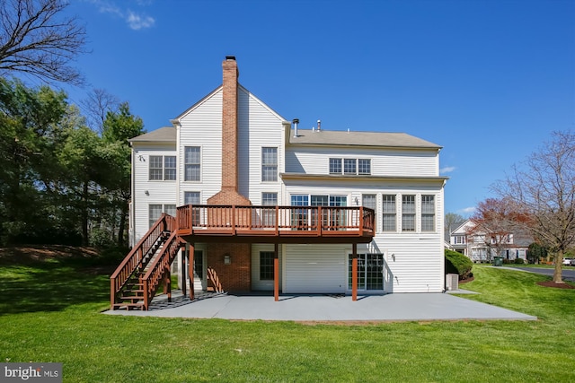 back of house featuring a patio, a chimney, a wooden deck, and a yard